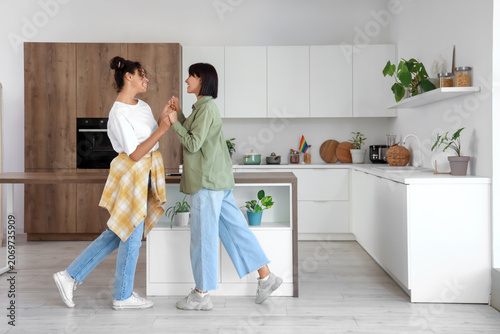 Young lesbian couple dancin...
