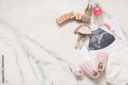 Composition with baby shoes...