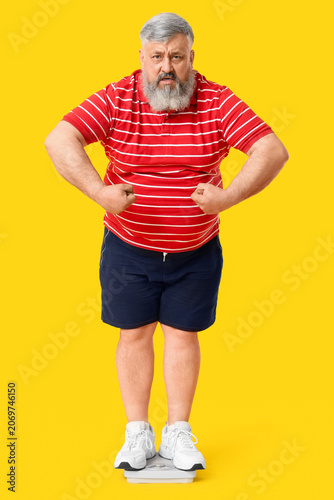 Overweight mature man with ...