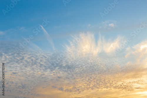 Pastel Sunset Sky Background with Soft Clouds and Golden Horizon