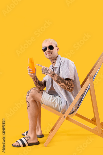 Tattooed man with sunscreen...