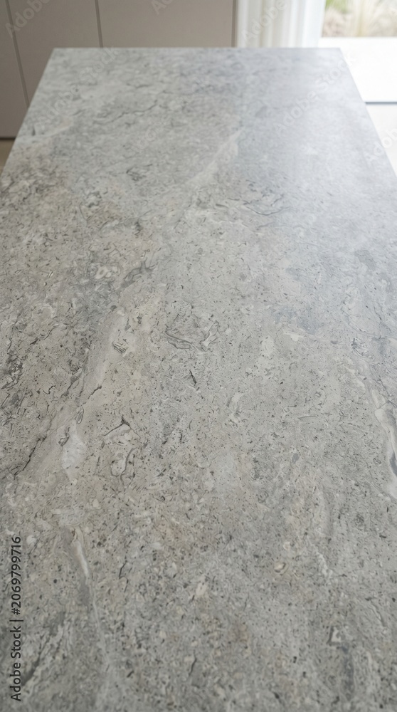 Fototapeta premium Modern grey limestone texture background in white light polished empty wall paper. luxury gray concrete stone table top desk view concept grunge seamless, Rustic marble slab. 