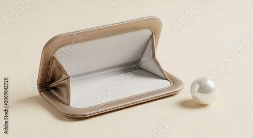 Pearl jewelry box with white interior.