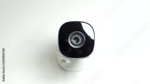 Effective Surveillance: CCTV security camera mounted on a white wall, ensuring protection and continuous monitoring.