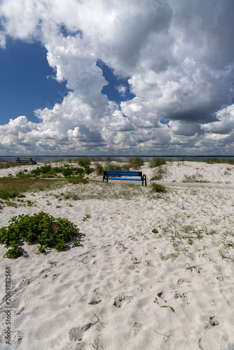 Empty bench along EuroVelo 10 R10 bike path on sand dunes of Hel Peninsula, Poland