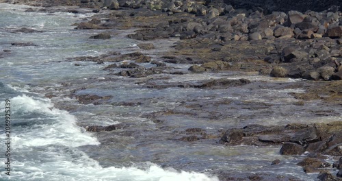 Waves crashing over rocks at Playa Blanca