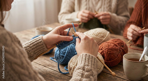 Women knitting in circle at table