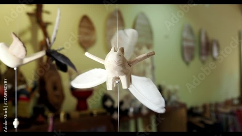Close-Up Of Hand Carved Bird Wooden Mobile.