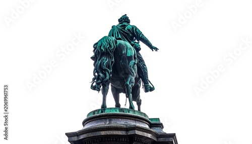 A statue of an equestrian figure, green patina against a blank sky. The monument's detail is visible