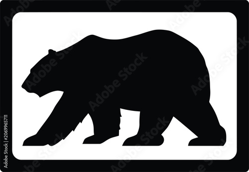 Silhouette of a walking grizzly bear in profile view.