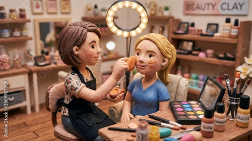 Miniature Clay Figures Of Makeup Artist Applying Foundation On Client In Studio Scale Model