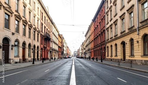 A straight road is flanked by ornate, colorful buildings stretching into the distance under a bright sky
