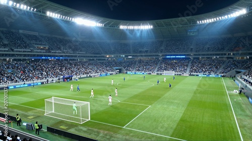 Nighttime football match in a modern illuminated stadium