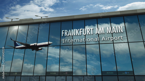 Airplane landing at Frankfurt am Main Germany airport mirrored in terminal
