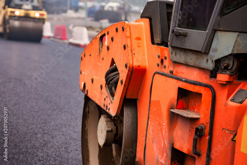 Fotografie Paving Process of Asphalt Concrete on a City Road During Daylight in an Urban Ar