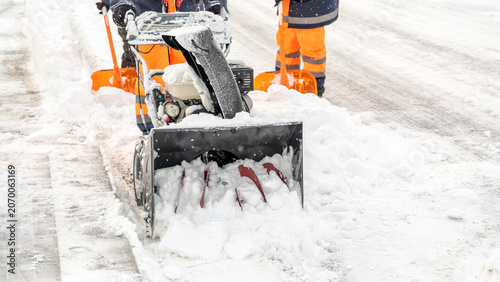 Картината върху платно Snow plow clears path with force