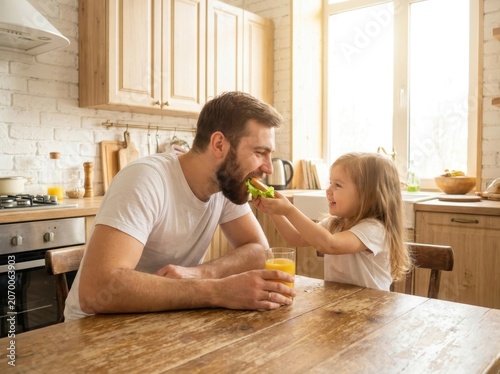 Father and daughter sharing a happy meal together in a sunlit kitchen.
