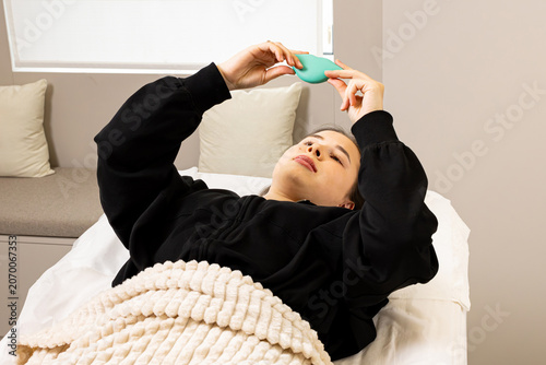 Photos A picture of a very beautiful and attractive young lady showing the process of lip injection and rejuvenation, in a professionally arranged office