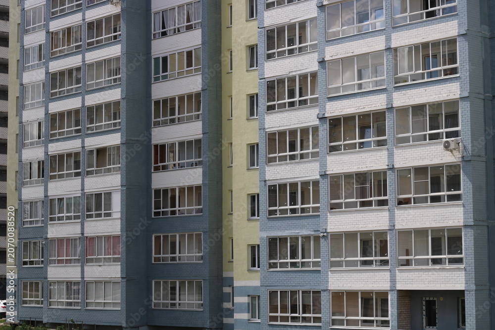 Fototapeta premium a residential building in the entire frame, a multi-storey building in close-up,