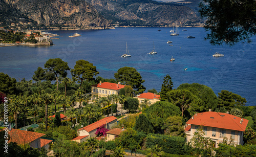 Aerial view of luxury villas on Saint Jean Cap Ferrat peninsula on the French Riviera, South of France, with boats on the Mediterranean Sea
