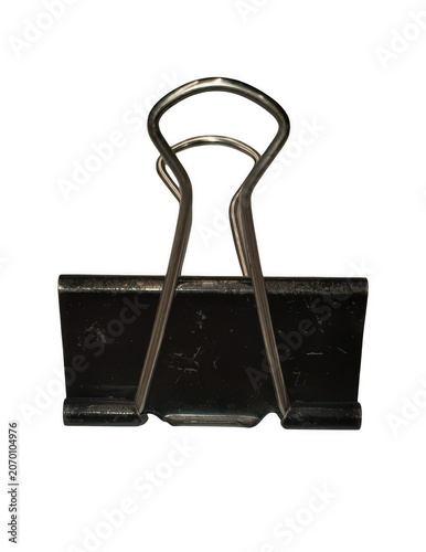 A single black metal binder clip isolated against a solid black background