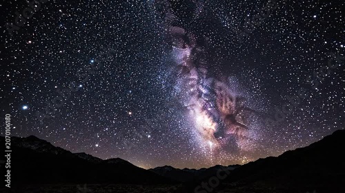 The Celestial River A breathtaking panorama of the Milky Way galaxy unfolds across the night sky with countless stars forming a luminous river flowing above a silhouetted mountain range