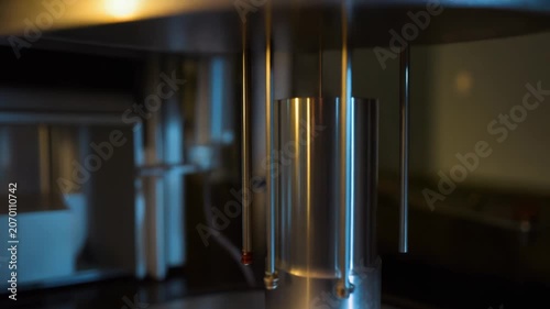Advanced scientific equipment conducting precise material analysis in a laboratory setting, supporting chemistry, physics, and biotechnology research and innovation