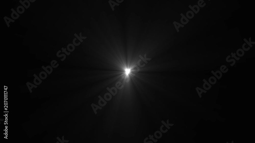 Bright white lens flare effect with radiating light beams on a solid black background for cinematic lighting and visual overlays