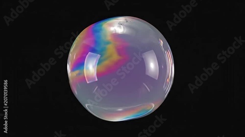 An iridescent liquid sphere floating against a dark black background