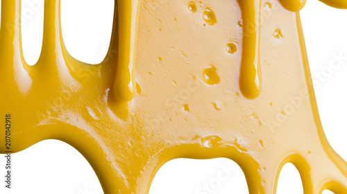 Photos Thick golden honey dripping in viscous streams, isolated on transparent backgrou