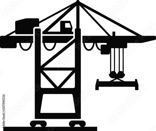 A large crane lifting heavy equipment on an industrial site with a gantry