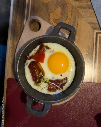 Fried Egg with Bacon in Small Metal Pan - Rustic Breakfast Food Closeup