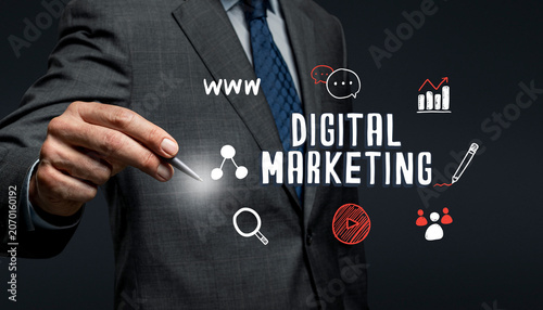 Digital Marketing Strategy Concept with Businessman Using Hologram Interface for Online Advertising and Analytics