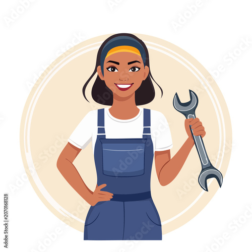 Smiling woman holding a wrench in overalls