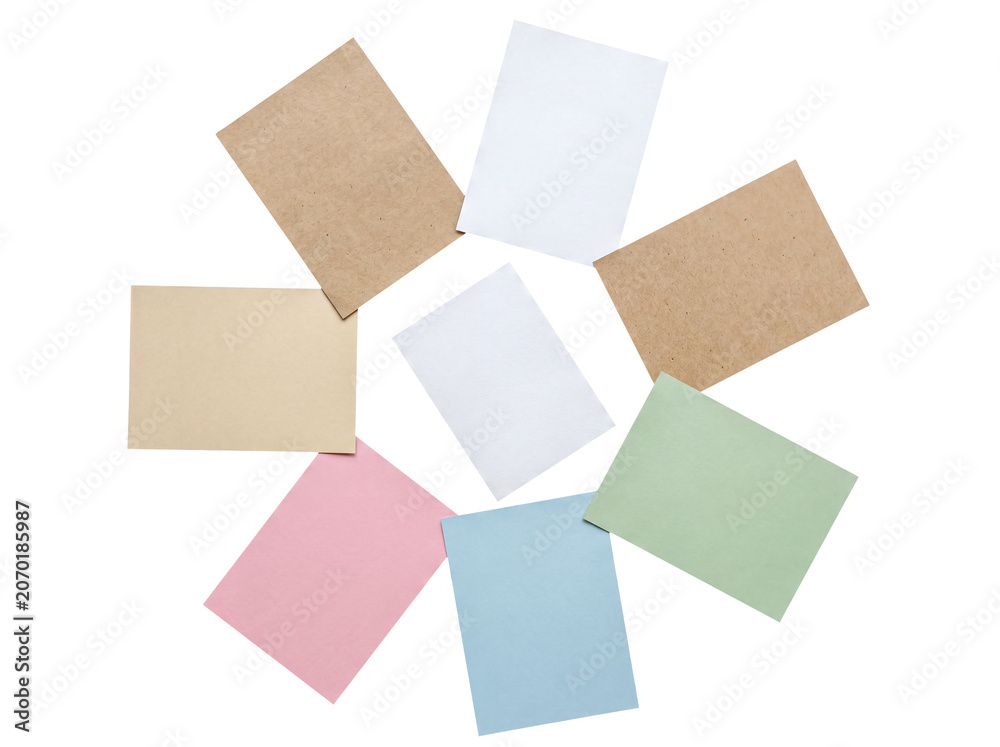 Fototapeta premium Variety of blank pastel and natural tone paper sheets forming a decorative circle, perfect for custom content.