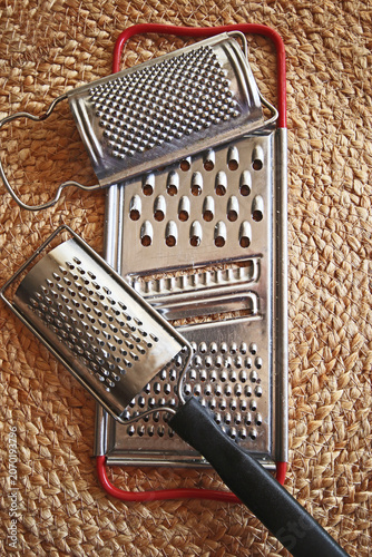 Kitchenware: used grater for parmesan and vegetables  on natural background
