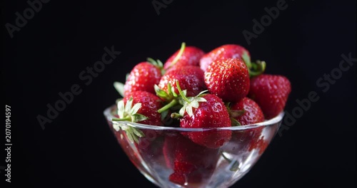 Red ripe strawberries laid out on a dessert plate. Fruit dessert. Natural vitamins.