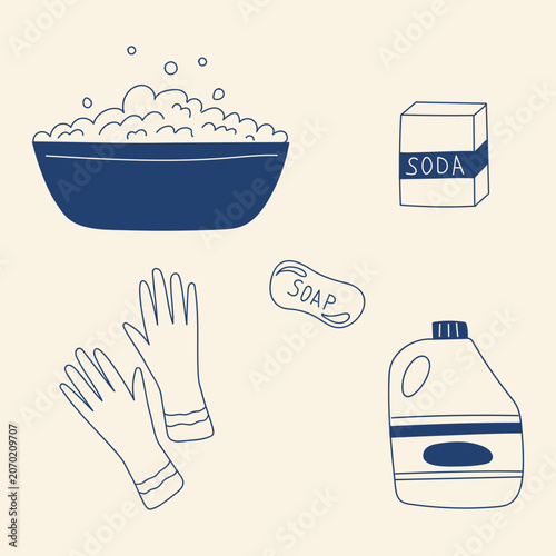 Cleaning supplies and tools arranged on a simple background with soap, gloves, and a container of soda