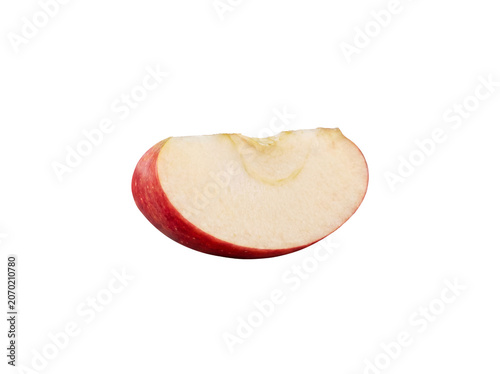 Vászonkép Photograph of a vibrant red apple slice with a fresh bite taken out, highlighting healthy snacking and natural food