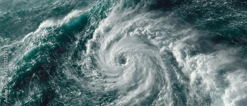 Panel kuchenny z motywem A massive swirling hurricane dominates the turbulent ocean background, illustrating the raw power of natural disasters and climate change.
