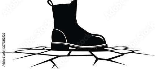 Fotografie Black silhouette of a heavy work boot crushing cracked ground surface