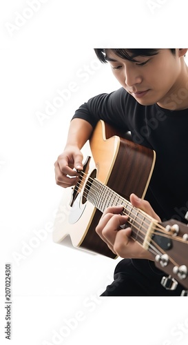 Young Musician Plays Acoustic Guitar Close Up.