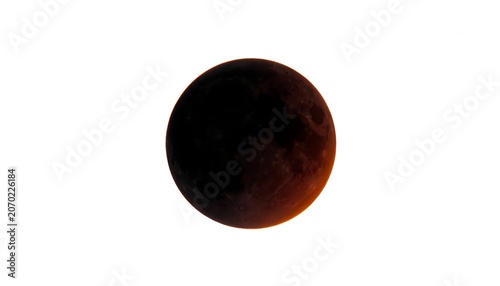 A stunning shot showcases a partial lunar eclipse. The shadowed sphere reveals subtle orange hues from sunlight refraction