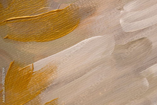 Elegant abstract background featuring rich metallic gold brush strokes layered over a neutral hand-painted texture. Ideal for luxury branding, cosmetics, premium packaging, wedding stationery, beauty 