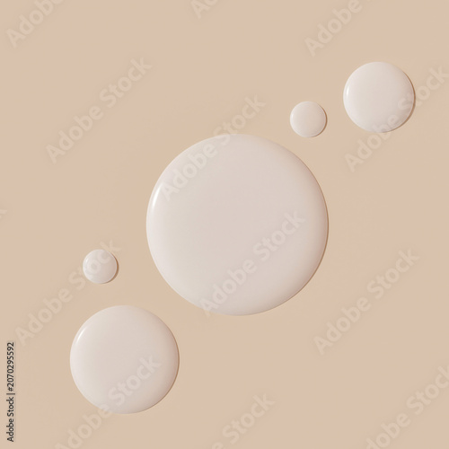 Beige cream liquid smears and drops forming an abstract minimalistic top banner layout for cosmetic foundation brand advertising dermatology product presentation 