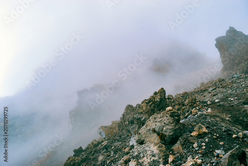 Mist Shrouding the Rugged Rock Formations in the Alpine Desert Zone of Mount Meru, Arusha National Park, Tanzania
