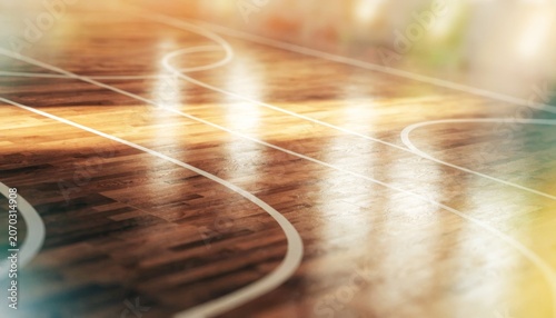 Polished wooden basketball court with glowing lines and warm lighting