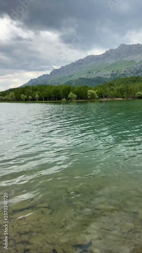 Majestic Mountain and Forest Reflections on Shimmering Lake Timelapse