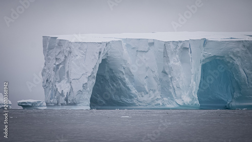 Tabular Iceberg Face with Blue Ice Arches