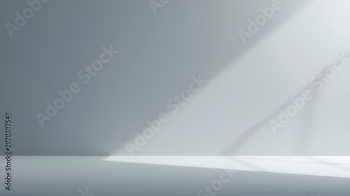 Minimalist interior with soft light and shadow creating a serene and clean atmosphere.